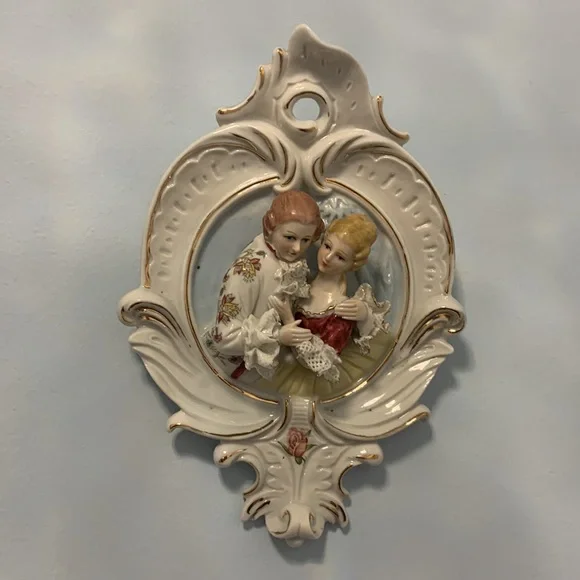 Porcelain mirror made in Italy 26”x 15”x4” plus 2 wall decorations 6”x9”